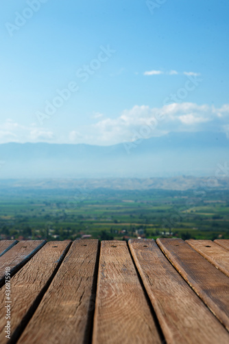 Wooden old background on natural background with mountain and sk