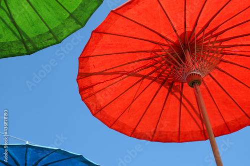 Under side of red handmade paper umbrella.