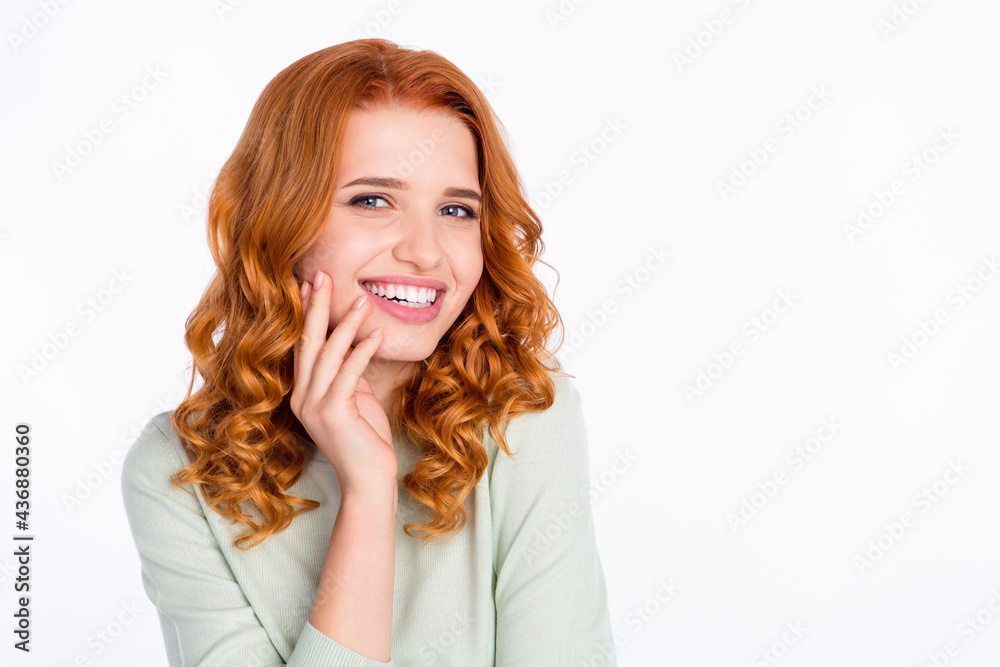 Photo portrait of red haired young girl touching face in casual outfit smiling isolated on white color background with copyspace Photo portrait of red haired young girl touching face in casual outfit smiling isolated on white color background with copyspace