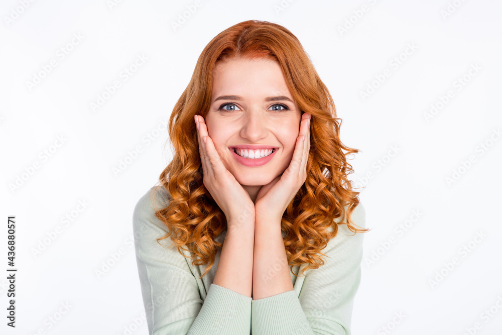 Photo portrait of red haired woman smiling touching cheeks overjoyed isolated on white color background Photo portrait of red haired woman smiling touching cheeks overjoyed isolated on white color background