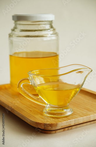 Freshly made liquid homemade ghee butter oil. Healthy food concept. Ayurveda product