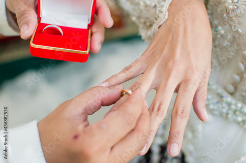 wed couple's hands with wedding rings asia