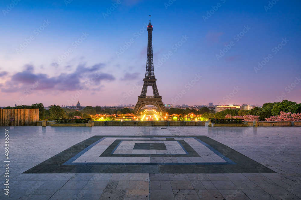 Paris skyline at dusk with Eiffel Tower seen from Place du Trocadero