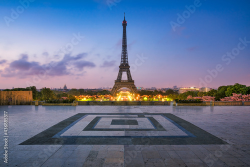 Paris skyline at dusk with Eiffel Tower seen from Place du Trocadero photo