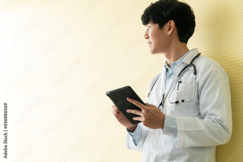Young Asian doctors using tablets to check data and information for the health examination of patients. Concept of digital, technology and communication for medical. Young Asian doctors using tablets to check data and information for the health examination of patients. Concept of digital, technology and communication for medical.