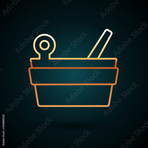 Gold line Sauna bucket and ladle icon isolated on dark blue background. Vector