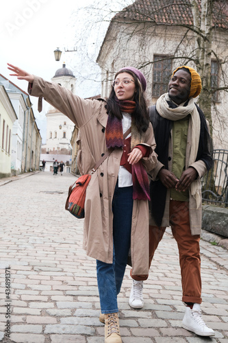 Couple of tourists going sightseeing together in the city