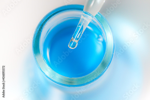 blue liquid pipette and bottle see lab images