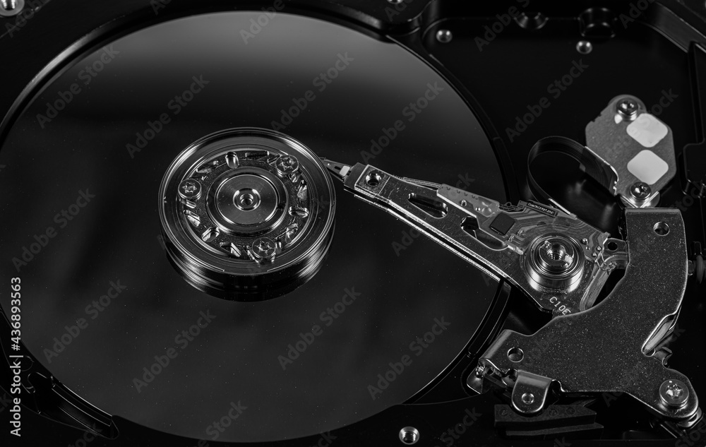 hard disk macro,Disassembled hard drive from the computer, hdd with mirror effect. Opened hard drive from the computer hdd with mirror effects. Part of computer pc, laptop. hard disk macro,Disassembled hard drive from the computer, hdd with mirror effect. Opened hard drive from the computer hdd with mirror effects. Part of computer pc, laptop.