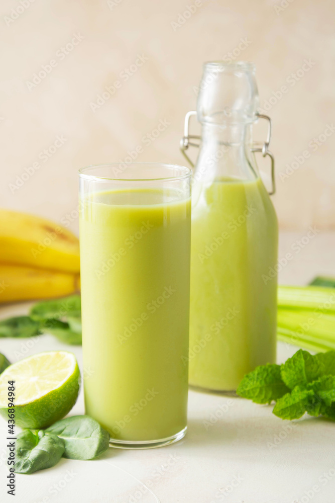 Detox drink. Green smoothie glass with fresh fruits and spinach. Healthy eating. Detox drink. Green smoothie glass with fresh fruits and spinach. Healthy eating.