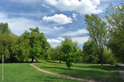 landscape with a green park and blue clouds on Izmailovsky island in Moscow