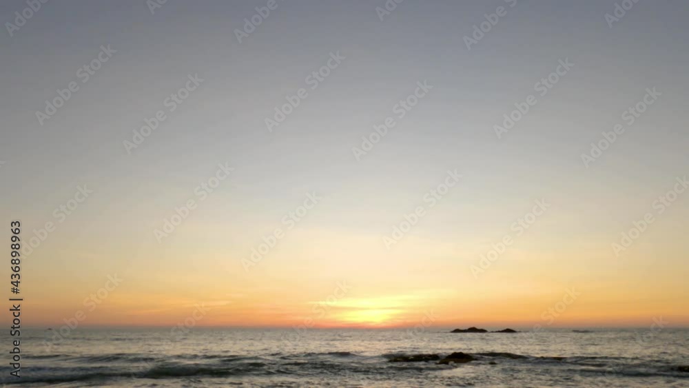 aerial view landscape sunset or sunrise sky at the sea. sun down at horizon. beautiful pastel orange evening sunlight. dawn first light in summer season. time lapse footage panoramic view blue sky aerial view landscape sunset or sunrise sky at the sea. sun down at horizon. beautiful pastel orange evening sunlight. dawn first light in summer season. time lapse footage panoramic view blue sky