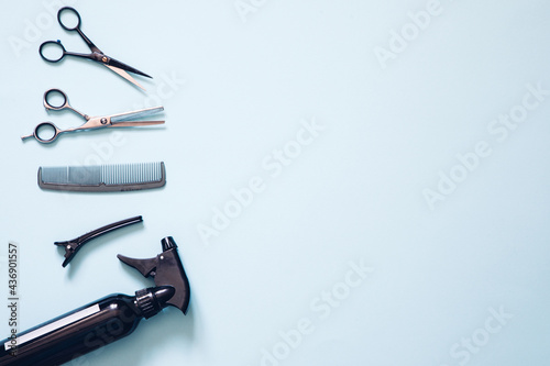 Set of professional hairdresser tools with combs and styling on dark wooden background top view mock up.