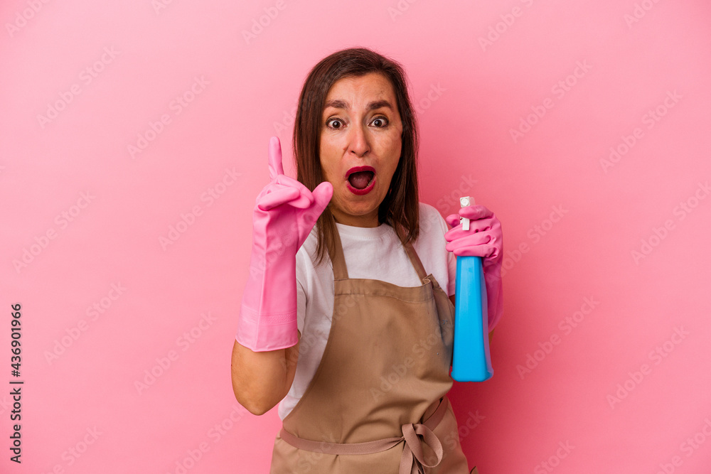 Middle age caucasian woman cleaning home isolated on pink background having an idea, inspiration concept. Middle age caucasian woman cleaning home isolated on pink background having an idea, inspiration concept.