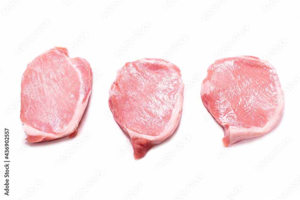 Raw pork pieces isolated on a white background.