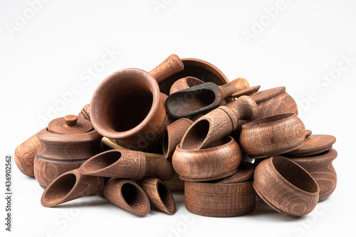 Set of wooden utensils close-up isolated on white background.