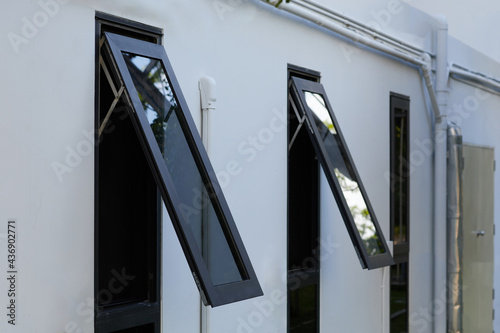 Black frame aluminium windows of building.