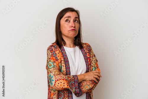 Middle age caucasian woman isolated on white background tired of a repetitive task.