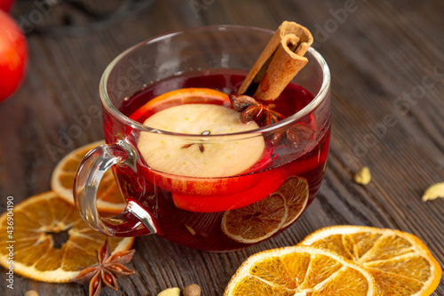 Mulled wine on a brown wooden table.