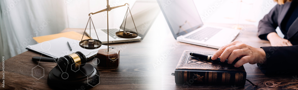 Business and lawyers discussing contract papers with brass scale on desk in office. Law, legal services, advice, justice and law concept picture with film grain effect Business and lawyers discussing contract papers with brass scale on desk in office. Law, legal services, advice, justice and law concept picture with film grain effect
