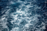 sea water wake, dark blue sea and white foam. Blue sea water texture. Water splashed use for graphic design.
