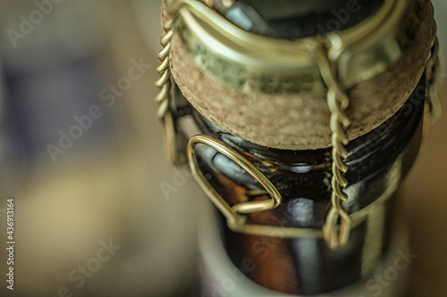 Wine bottle neck with cork fastened with wire above macro, very shallow DOF
