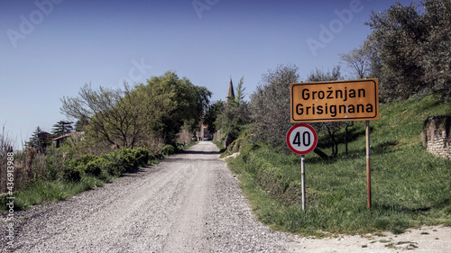 Central Istria, Croatia - Town sign with speed limit next to the dirt road leading to the medieval town of Grožnjan also known as Grisignana