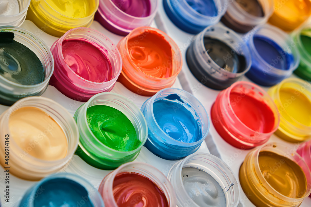 Closeup of messy, used water-color paint-box and paint brush. Closeup of messy, used water-color paint-box and paint brush.