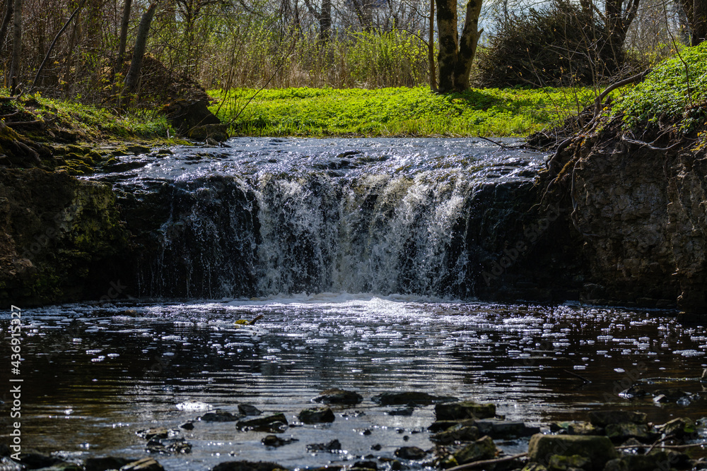 calm forest smal lriver with small waterfall from natural rocks calm forest smal lriver with small waterfall from natural rocks