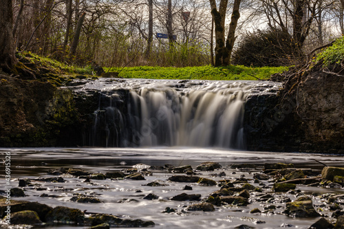 Fototapeta Naklejka Na Ścianę i Meble -  calm forest smal lriver with small waterfall from natural rocks