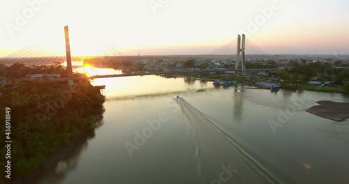 Atardecer en el Rio napo sobre el puente Majestuoso Rio Napo, Orellana, El Coca, amazonia, ecuador photo
