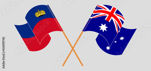 Crossed and waving flags of Liechtenstein and Australia