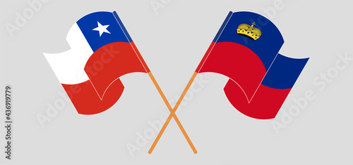 Crossed and waving flags of Chile and Liechtenstein