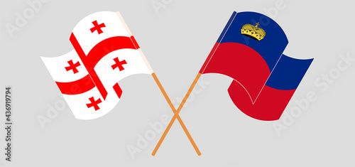 Crossed and waving flags of Georgia and Liechtenstein