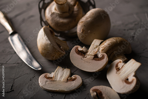 Champignon mushrooms on gray background