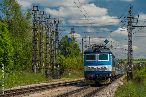Electric passenger retro train in one time station Nemanice in spring sunny day