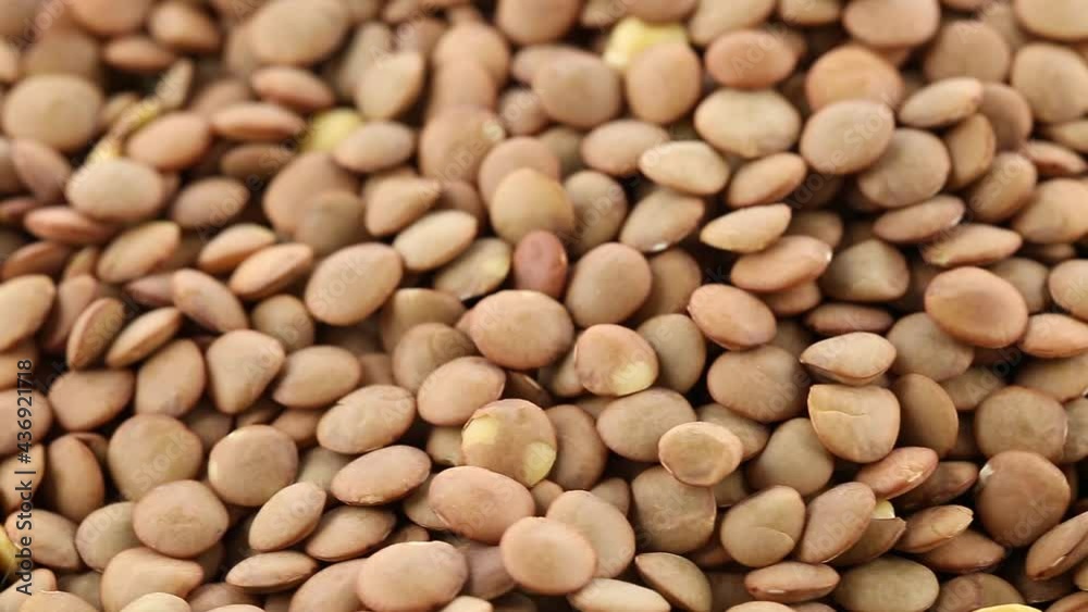Heap of lentils rotating close up macro view, source of plant-based protein and fiber, selective focus Heap of lentils rotating close up macro view, source of plant-based protein and fiber, selective focus