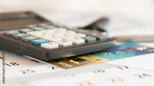 business with credit cards on calculator office desk white background, close up