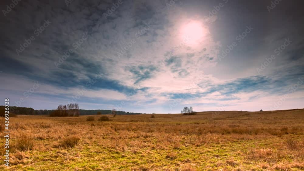 Autumnal grassland under cloudy sky in 4k time lapse. Autumnal grassland under cloudy sky in 4k time lapse.