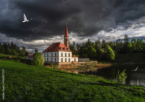 Dark storm at the ancient Maltese castle. Summer sunny landscape in the ancient Russian city of Gatchina. Russia