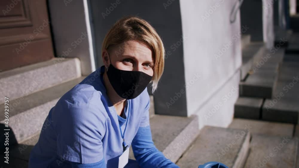 Upset woman caregiver, nurse or healthcare worker, looking at camera. Coronavirus concept. Upset woman caregiver, nurse or healthcare worker, looking at camera. Coronavirus concept.