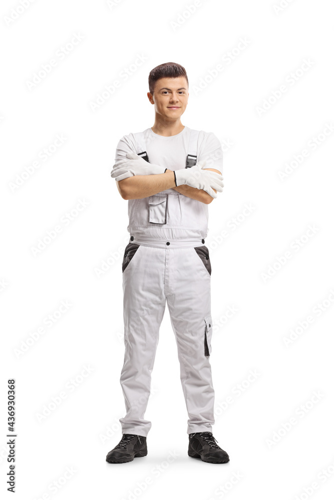 Full length portrait of a painter in a white overall uniform - obrazy, fototapety, plakaty 