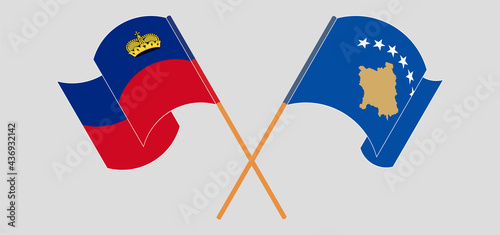 Crossed and waving flags of Liechtenstein and Kosovo