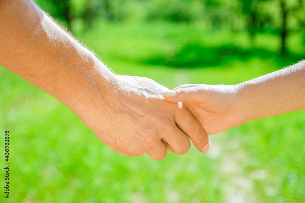 hands Happy parents and child outdoors in the park