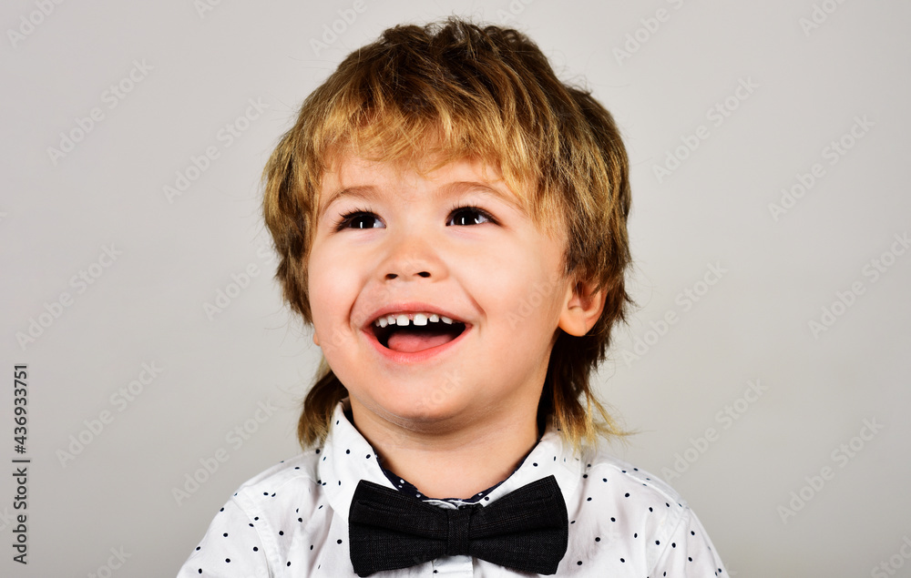 Small Boy smiling. Happy childhood, Positive kid. Closeup portrait. Fashionable little child in white shirt. Small Boy smiling. Happy childhood, Positive kid. Closeup portrait. Fashionable little child in white shirt.