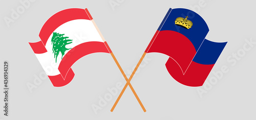 Crossed and waving flags of the Lebanon and Liechtenstein