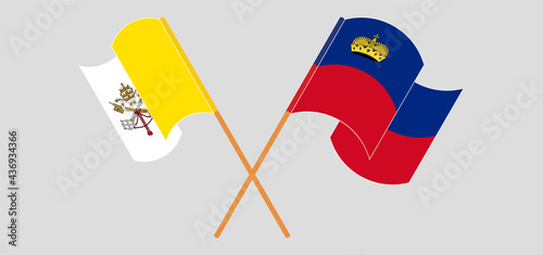 Crossed and waving flags of Vatican and Liechtenstein