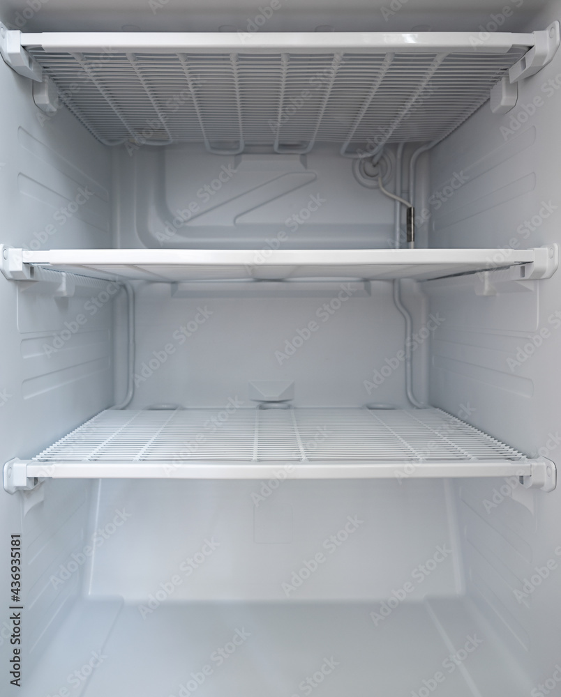 empty clean freezer in the fridge. empty shelves in the fridge empty clean freezer in the fridge. empty shelves in the fridge