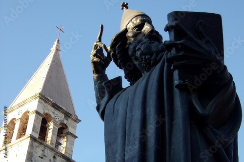 Bronze statue of Bishop Gregory of Nin (created in 1929 by Ivan Mestrovic) in front of the Saint Domnius Cathedral, Split, Croatia photo