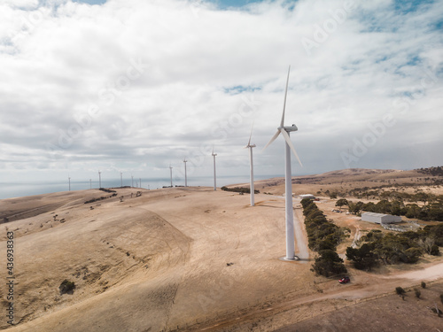 Aerial view of wind turbines on the hill at Starfish Hill Wind Farm along the coast facing St. Vincent Gulf in South Australia region, Australia.